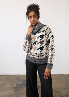 Close-up of black and beige sweater showcasing intricate pattern and cowl neck by French Dressing Jeans (FDJ)