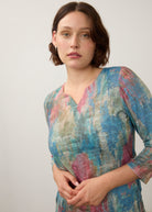 Close-up of pastel Henley top focusing on neckline and soft color blend by French Dressing Jeans (FDJ)