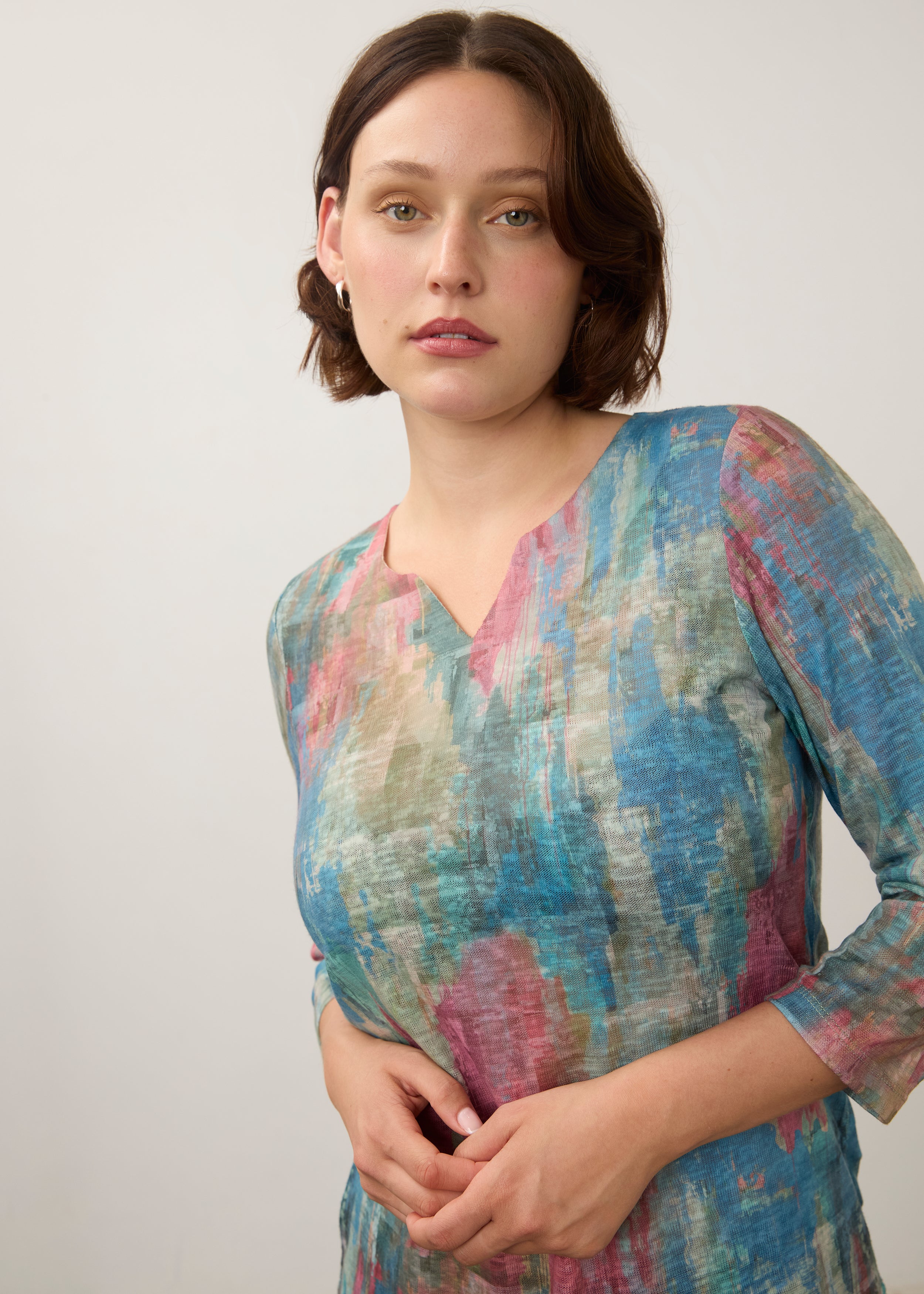 Close-up of pastel Henley top focusing on neckline and soft color blend by French Dressing Jeans (FDJ)