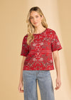 Front view of red Polynesian block print top featuring short sleeves and elegant print by French Dressing Jeans (FDJ)