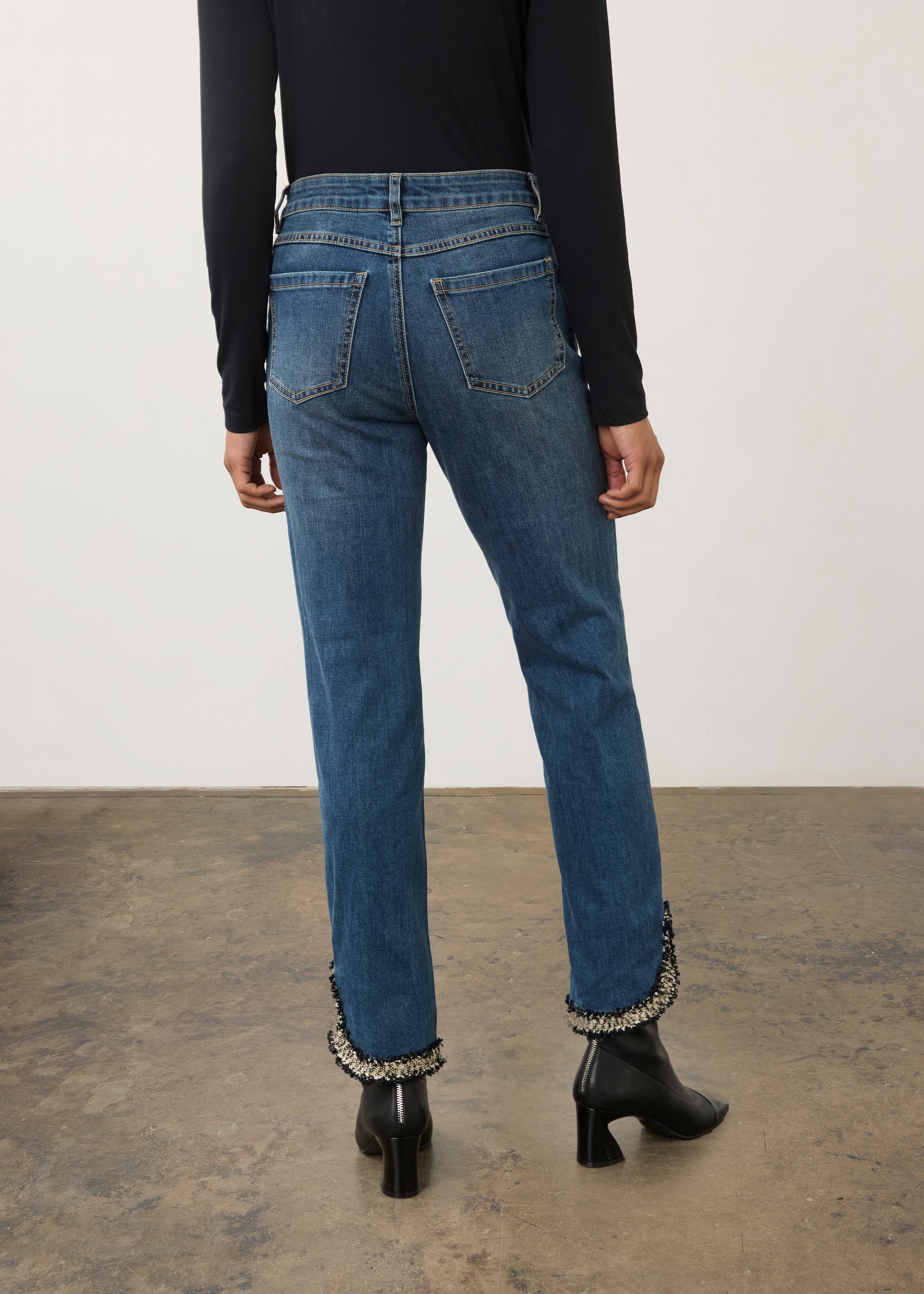 Back view of medium blue Olivia denim showing patch pockets and tapered legs by French Dressing Jeans (FDJ)