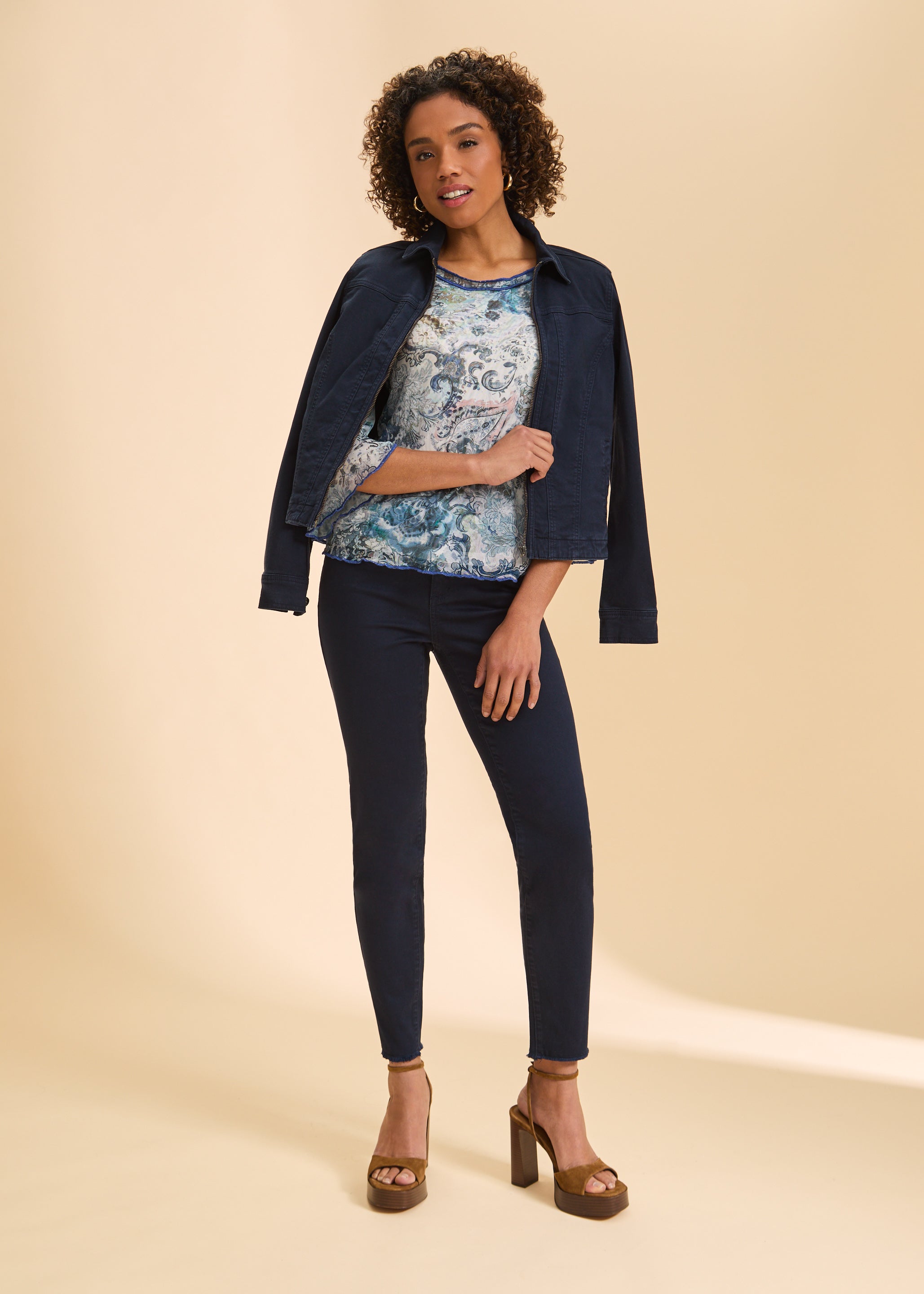 Full view of blue and white paisley top paired with denim jacket by French Dressing Jeans (FDJ)