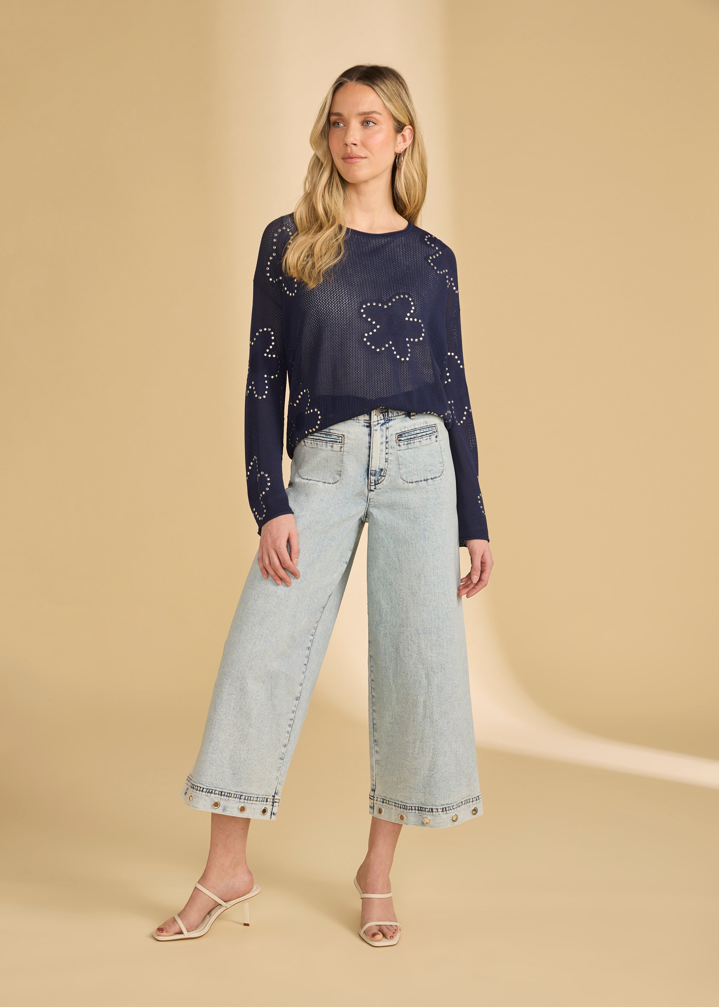 Full view of navy embellished sweater paired with light jeans by French Dressing Jeans (FDJ)