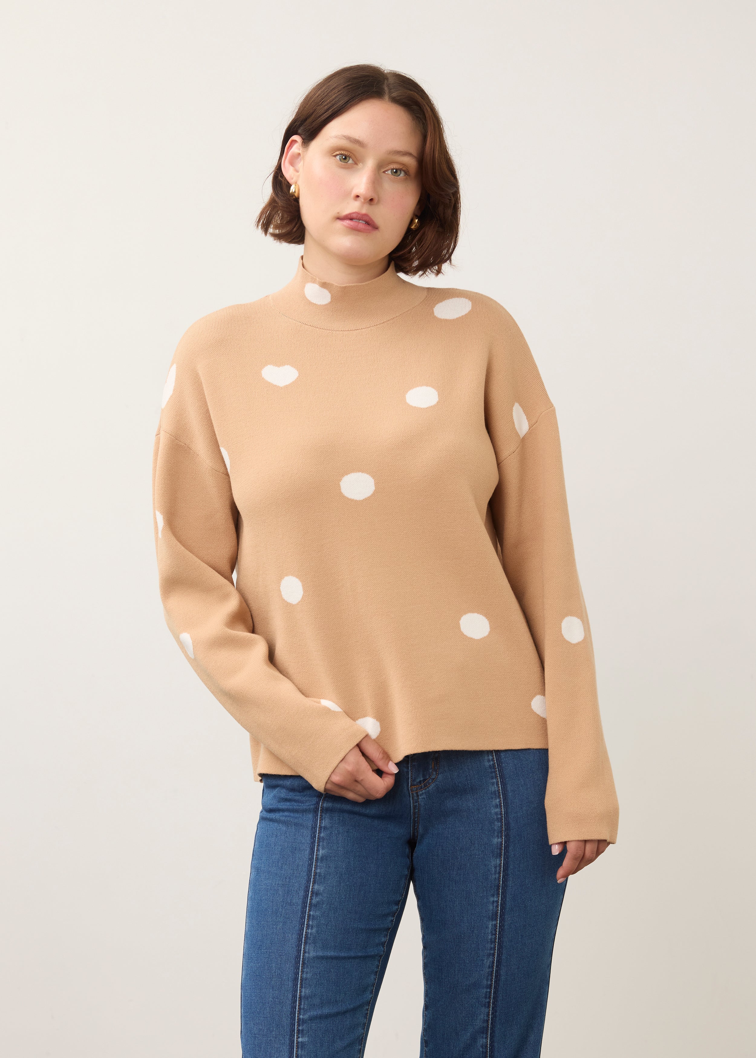 Front view of tan polka dot sweater with high collar and long sleeves by French Dressing Jeans (FDJ)