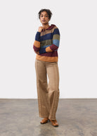 Full-body shot of maple wide leg denim paired with striped sweater, front view by French Dressing Jeans (FDJ)