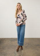 Full body view of floral V-neck top in Winter Taupe with denim jeans, casual look by French Dressing Jeans (FDJ)