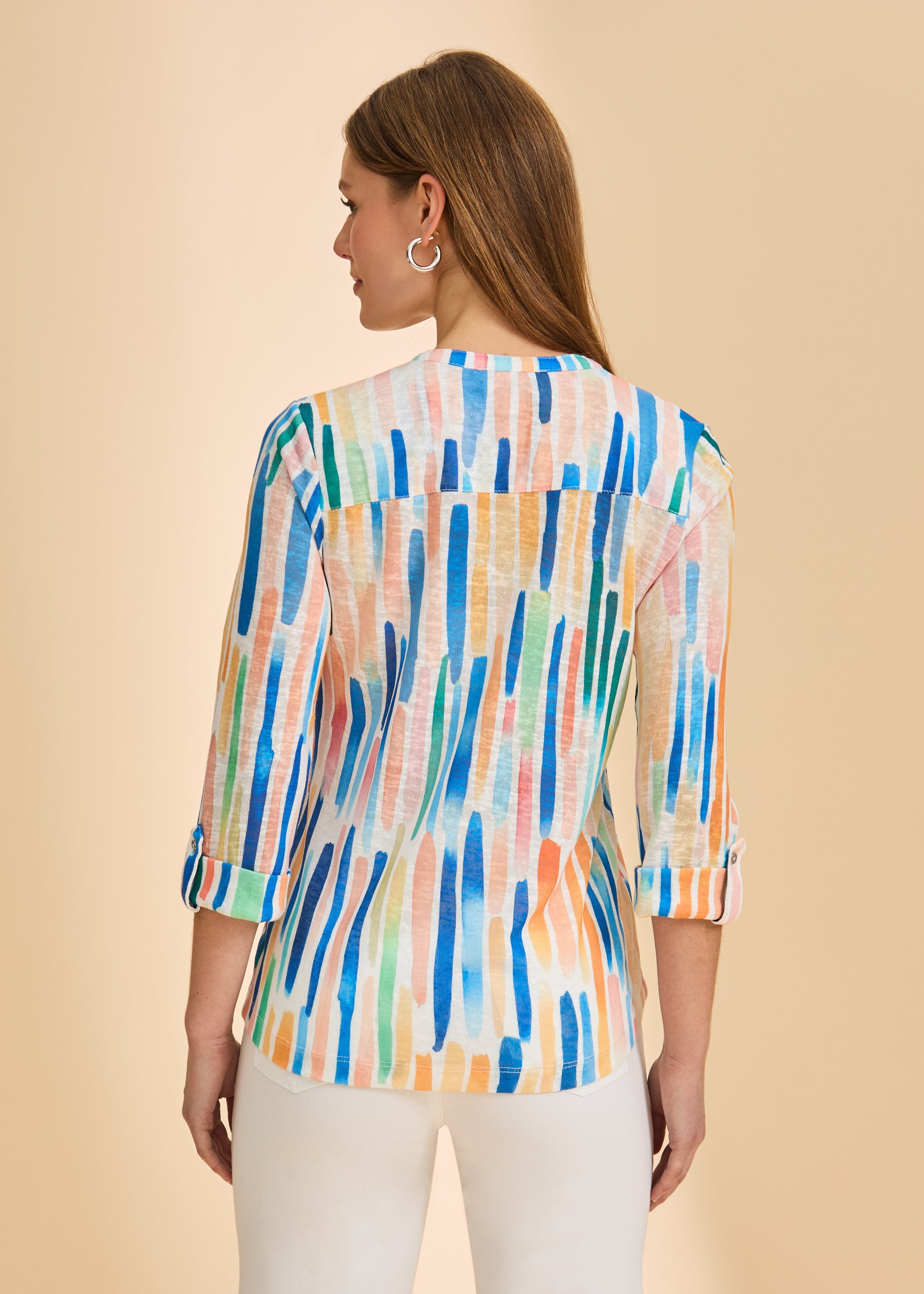 Back view of vibrant 3/4 sleeve Henley top featuring colorful stripe pattern by French Dressing Jeans (FDJ)