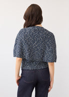 Back view of a textured blue knit top and dark wash denim showcasing back design and fit by French Dressing Jeans (FDJ)