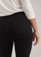 Close-up of black pants showing back patch pockets and fabric by French Dressing Jeans (FDJ)