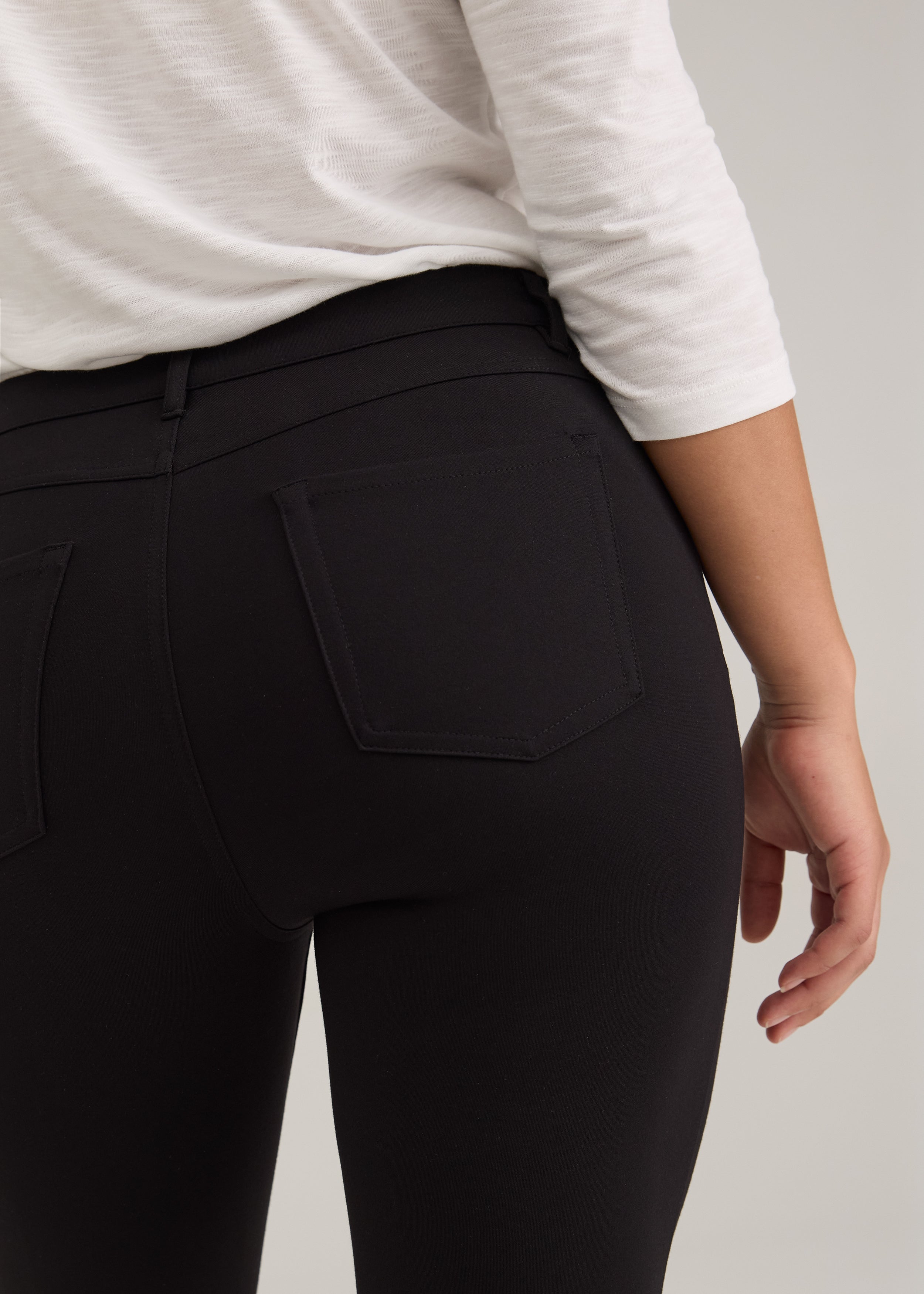Close-up of black pants showing back patch pockets and fabric by French Dressing Jeans (FDJ)