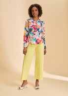 Full view of floral split neck shirt paired with yellow pants by French Dressing Jeans (FDJ)
