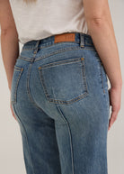 Detail shot of back pockets and waistline on light wash Olivia denim by French Dressing Jeans (FDJ)