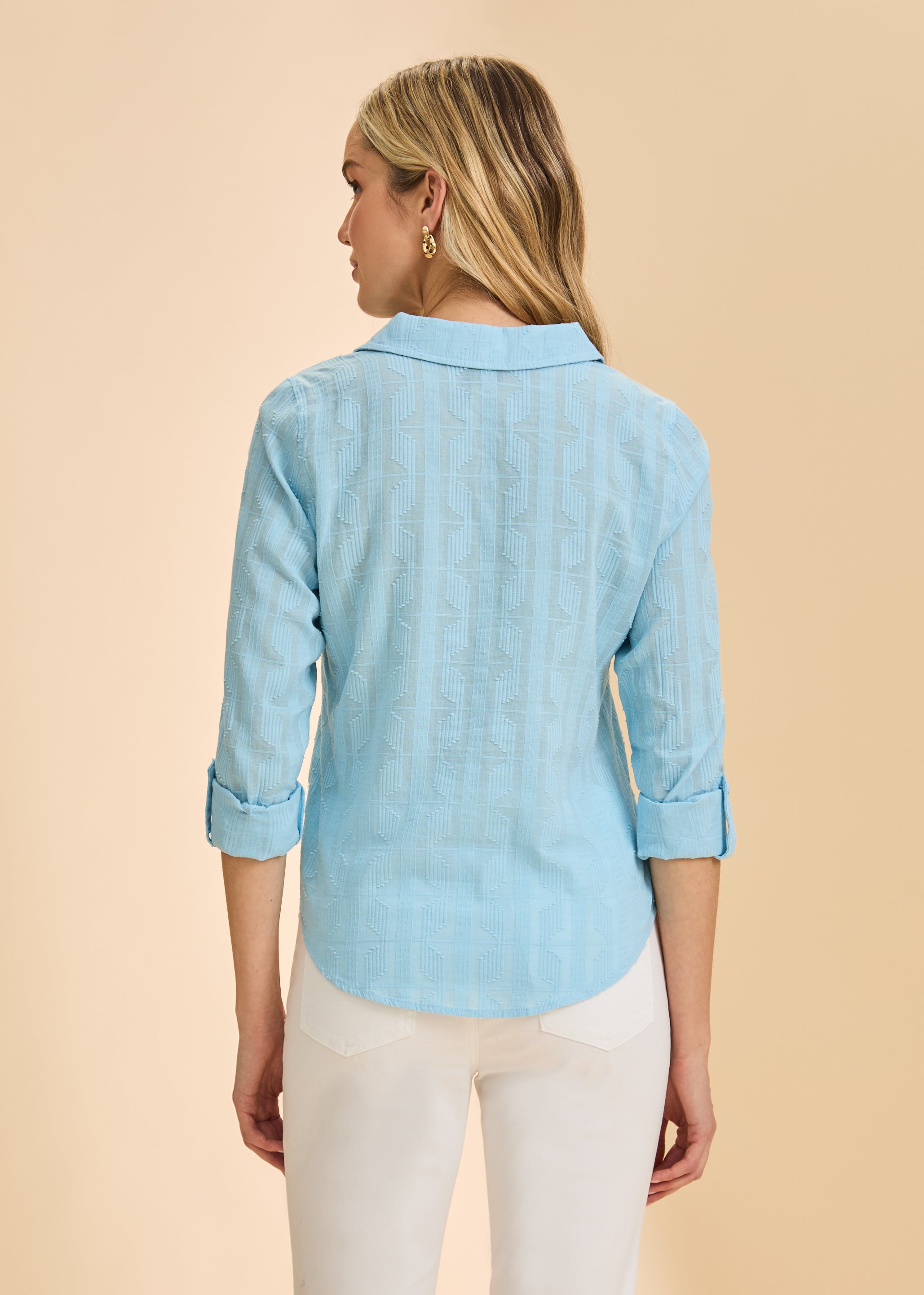 Back view of light blue textured shirt showing pattern and rolled cuffs by French Dressing Jeans (FDJ)