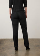 Back view of black straight-leg jeans highlighting rear patch pockets and seam lines by French Dressing Jeans (FDJ)