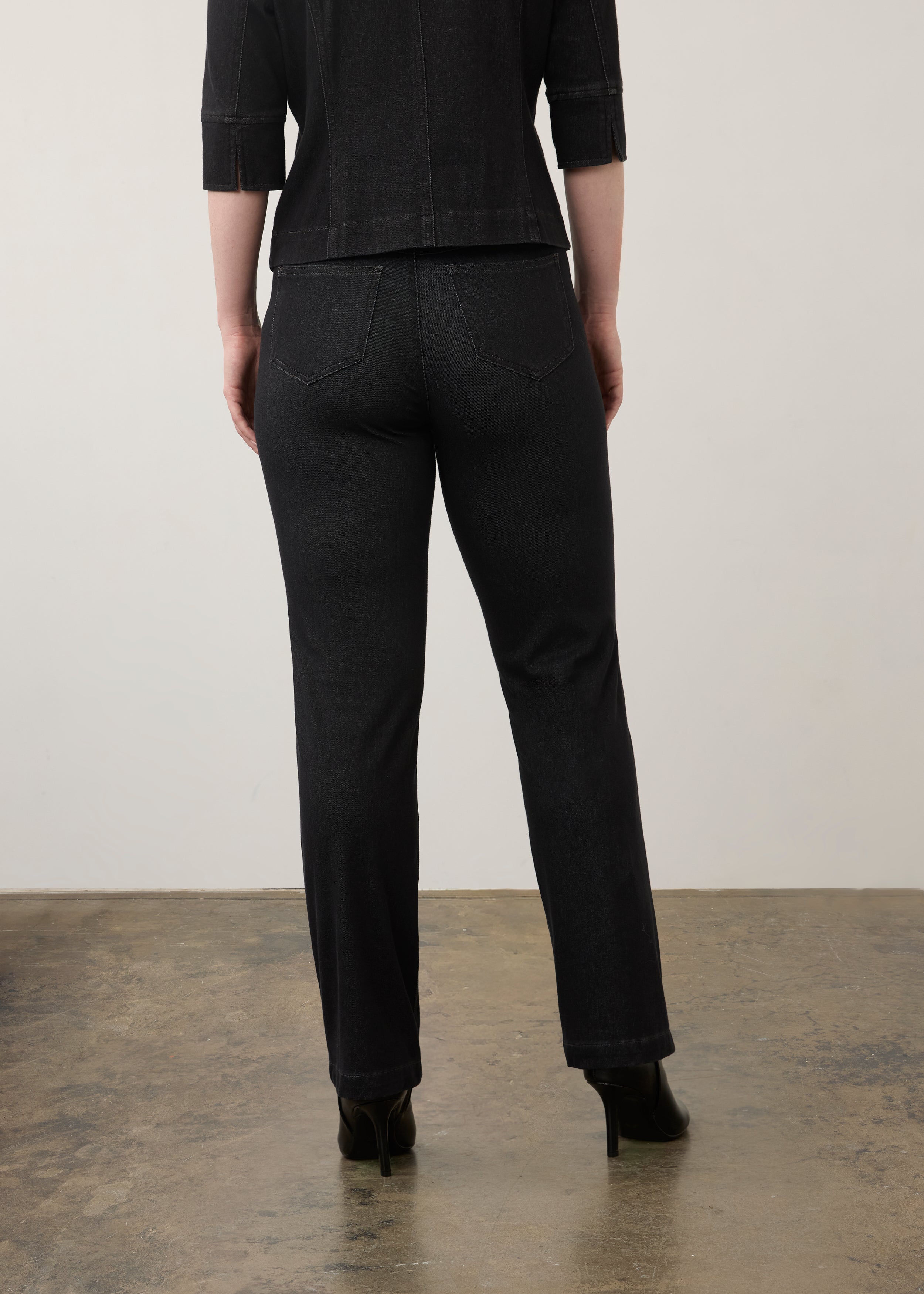 Back view of black straight-leg jeans highlighting rear patch pockets and seam lines by French Dressing Jeans (FDJ)
