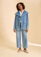 Full view of light blue denim jacket styled with wide-leg pants by French Dressing Jeans (FDJ)