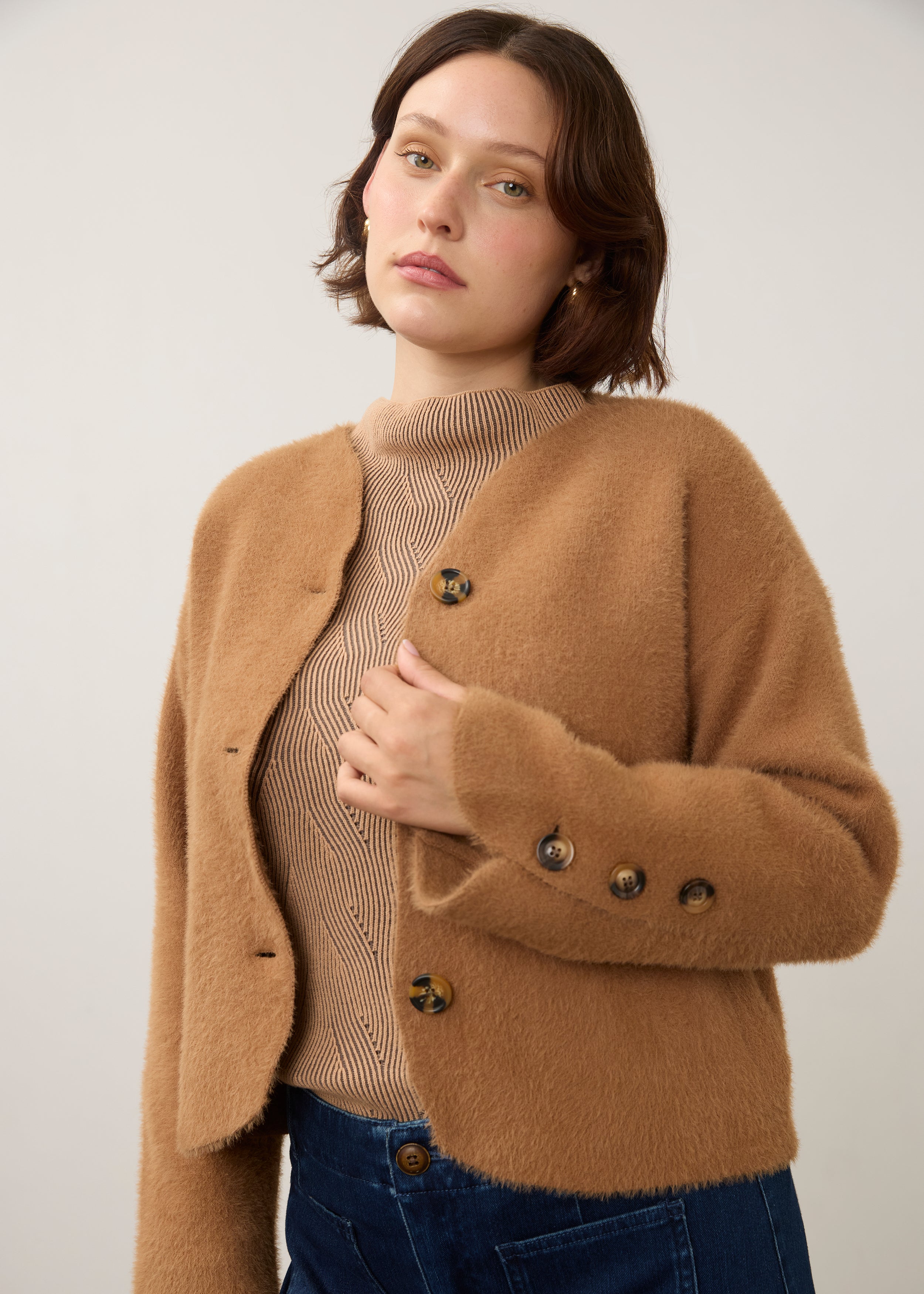 Close-up of camel knit cardigan showing button detail and soft texture by French Dressing Jeans (FDJ)