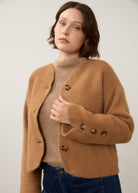 Close-up of camel knit cardigan showing button detail and soft texture by French Dressing Jeans (FDJ)