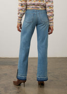 Back view of light wash denim pants featuring back patch pockets and relaxed fit by French Dressing Jeans (FDJ) par French Dressing Jeans (FDJ)