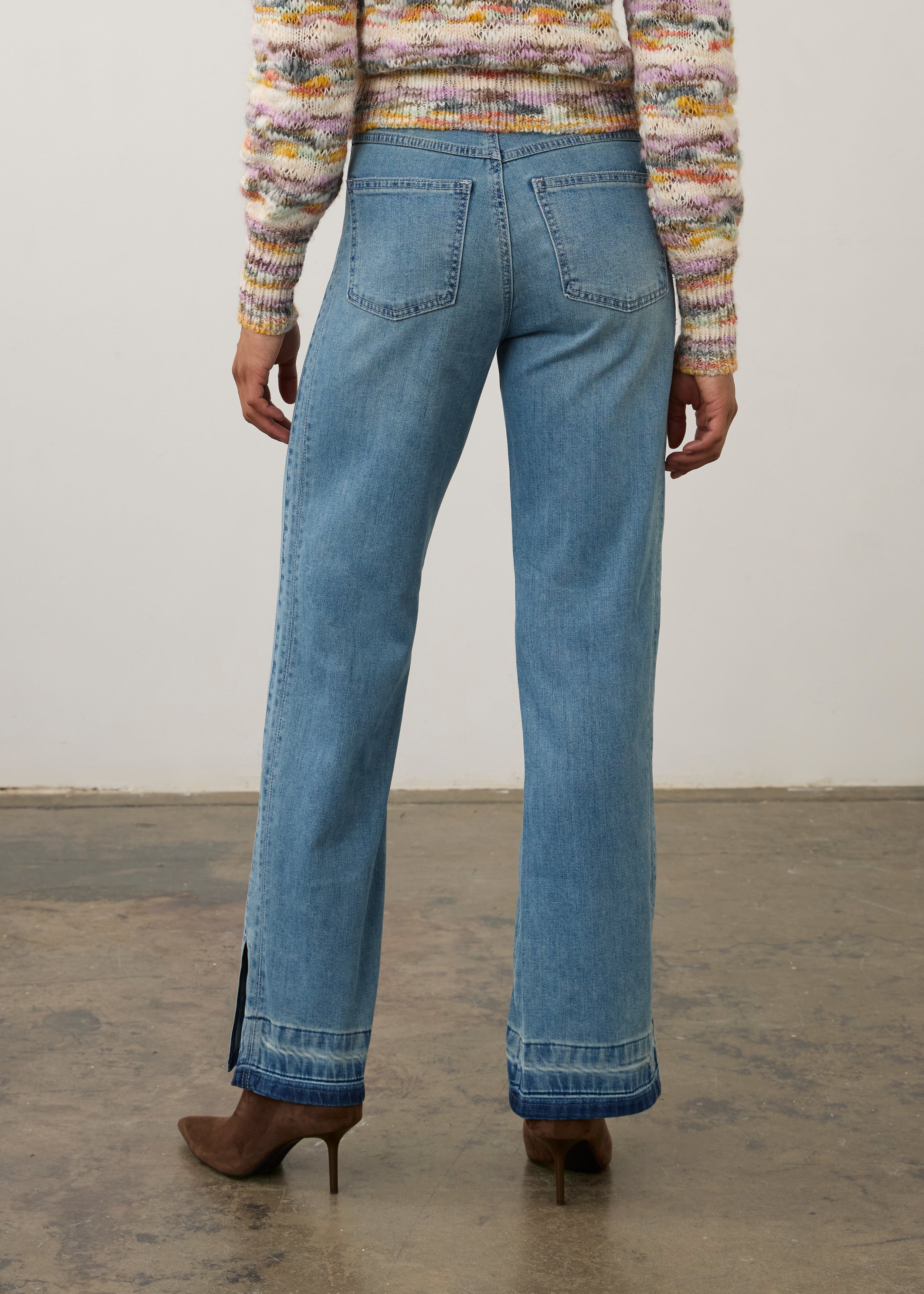 Back view of light wash denim pants featuring back patch pockets and relaxed fit by French Dressing Jeans (FDJ) par French Dressing Jeans (FDJ)