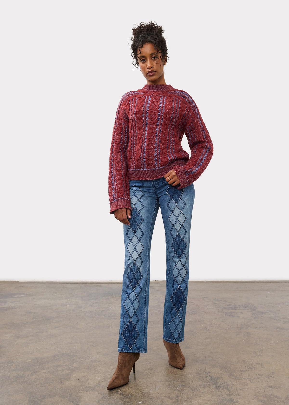 Full body view of maroon cabled sweater paired with jeans and heels by French Dressing Jeans (FDJ)