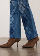 Close-up of indigo jeans fabric detailing diamond patterns on straight leg by French Dressing Jeans (FDJ)