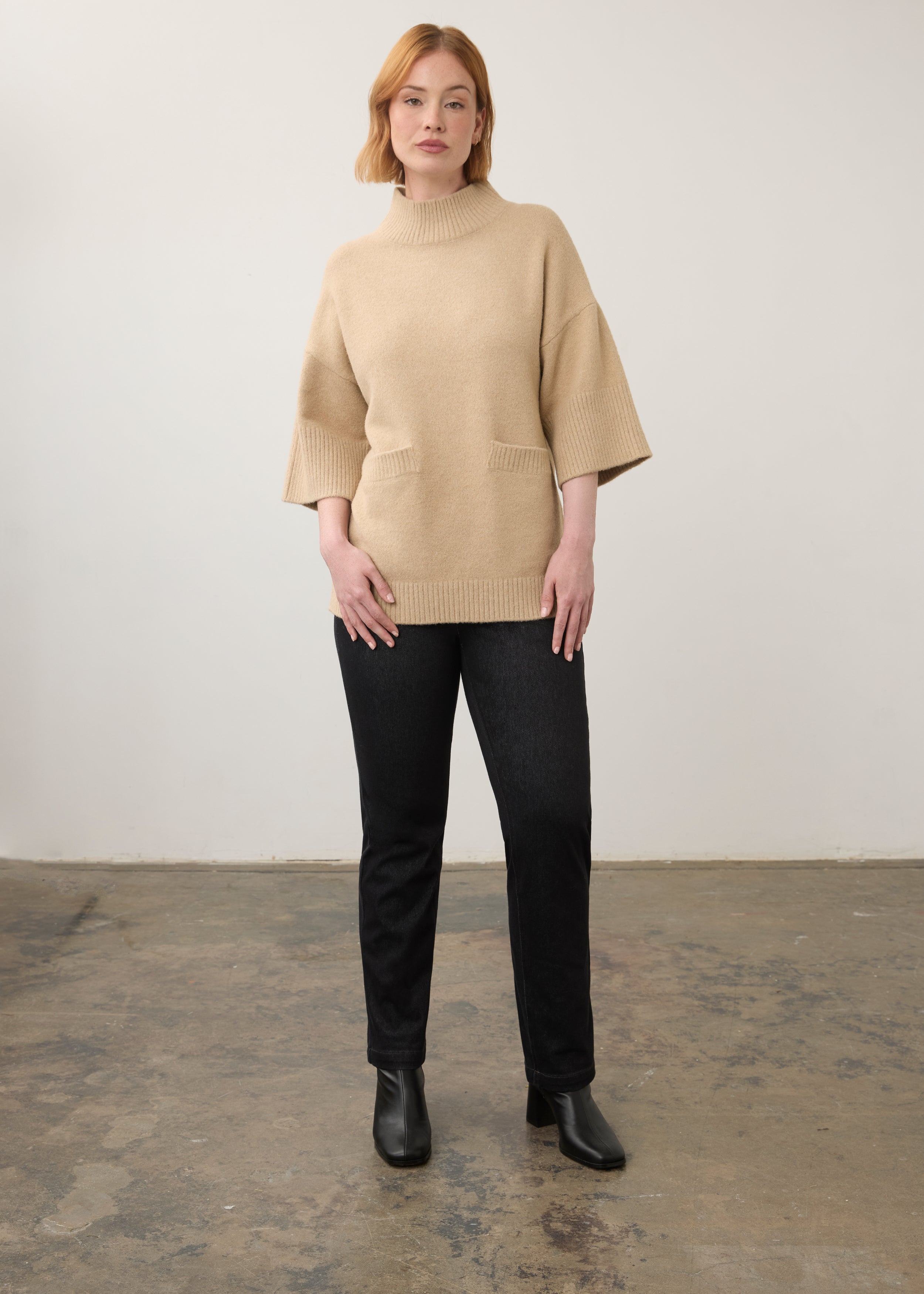 Full view of beige tunic sweater paired with black jeans by French Dressing Jeans (FDJ)