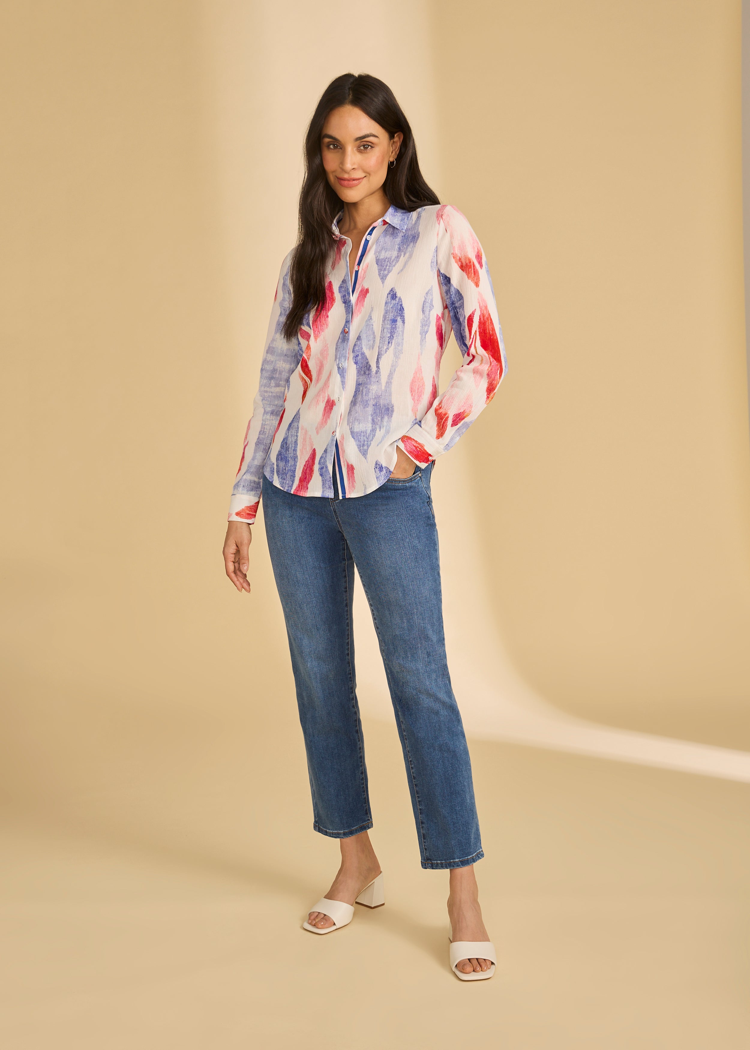 Model in dark wash pull-on ankle jeans with a colorful blouse by French Dressing Jeans (FDJ)