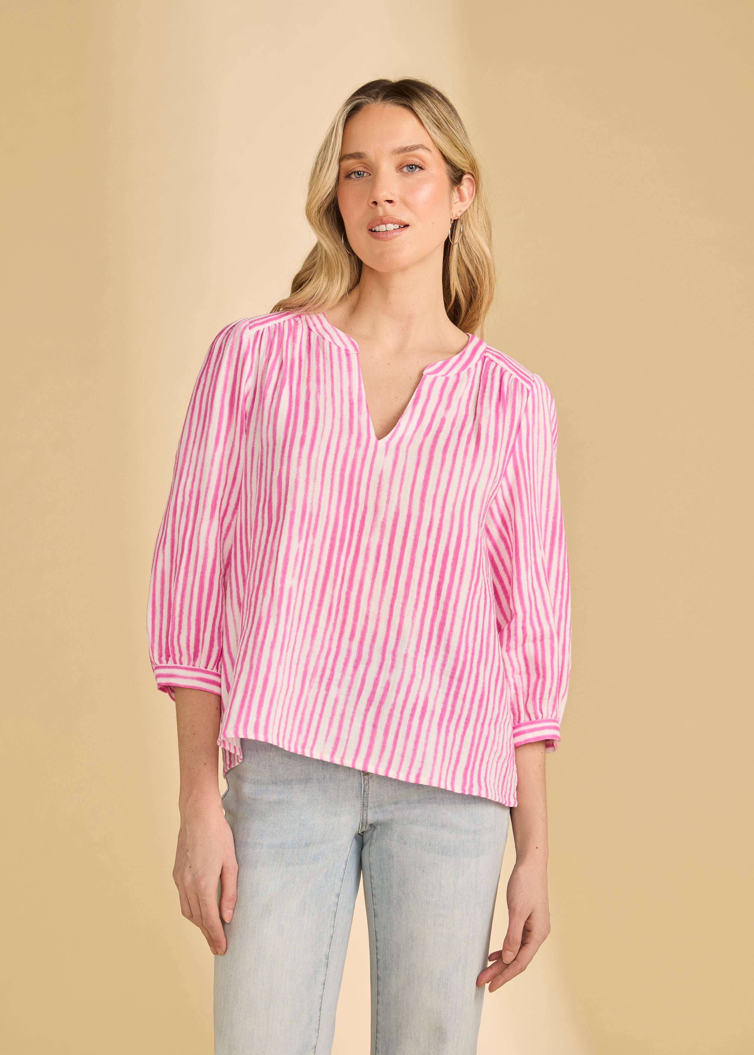 Front view of pink striped blouse with V-neck and 3/4 sleeves by French Dressing Jeans (FDJ)
