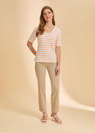 Full outfit with orange striped V-neck top and beige pants for casual style by French Dressing Jeans (FDJ)