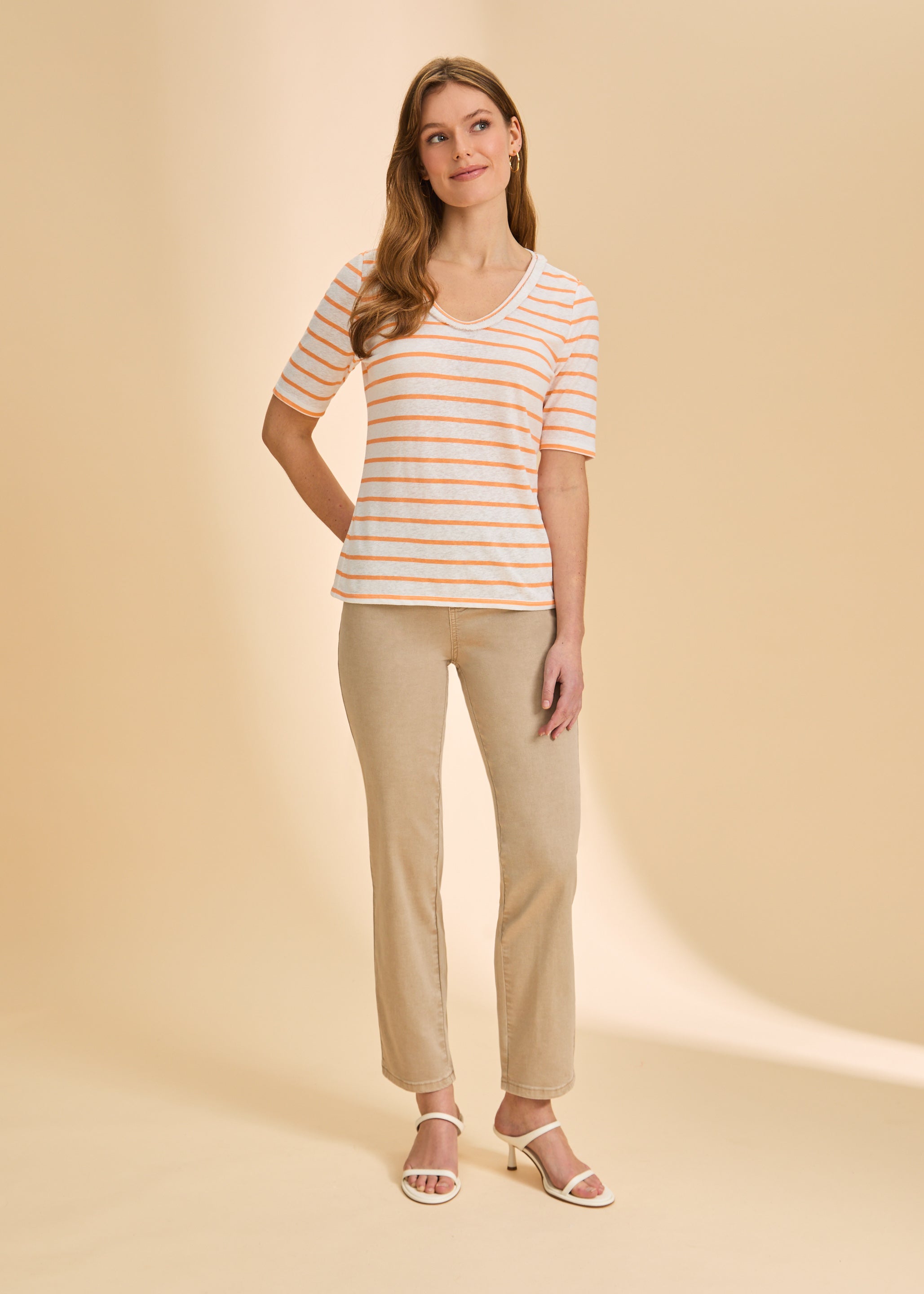 Full outfit with orange striped V-neck top and beige pants for casual style by French Dressing Jeans (FDJ)