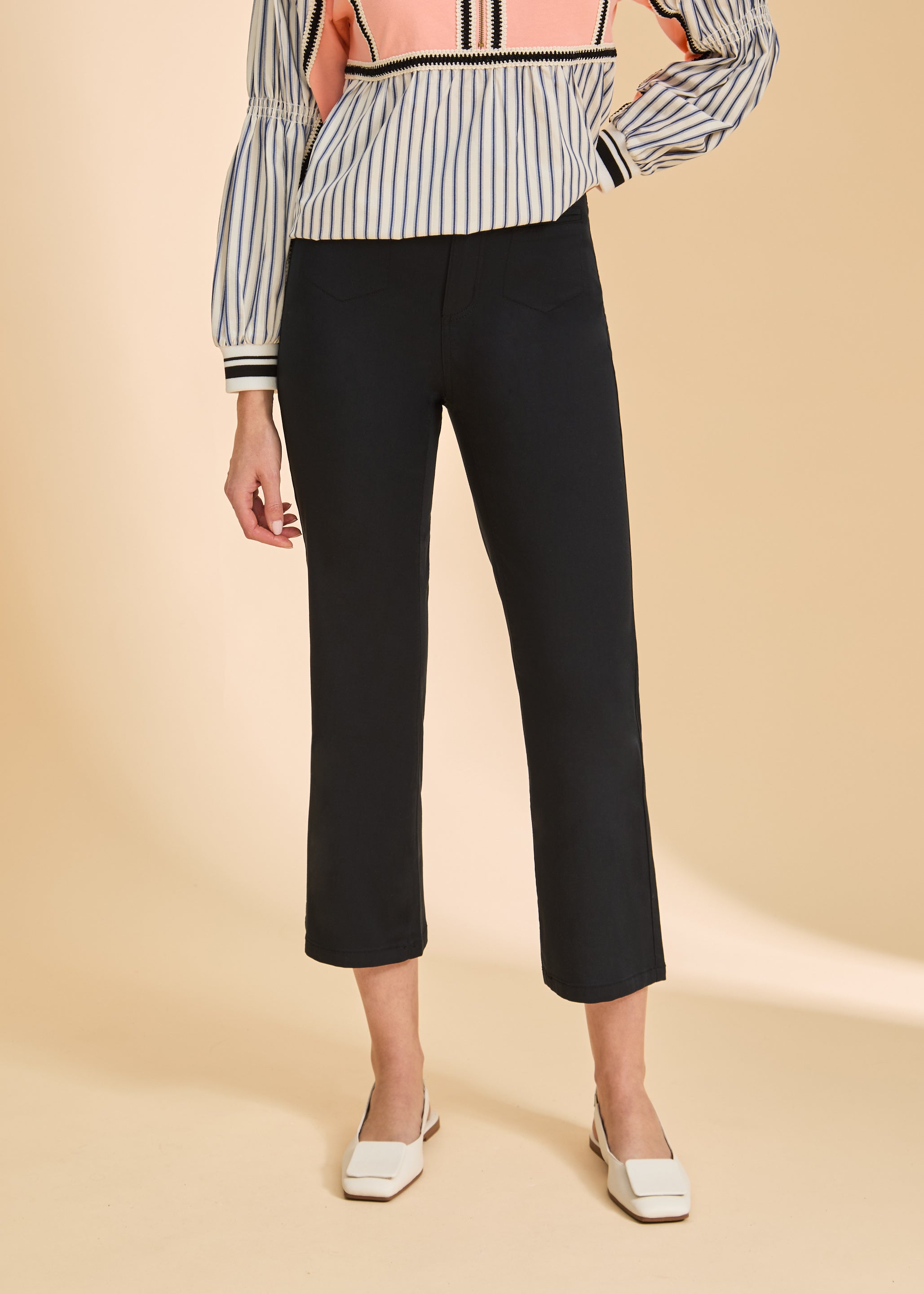 Close-up of black crop pants highlighting sleek silhouette and high-rise fit by French Dressing Jeans (FDJ)