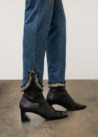 Side view of medium blue Olivia denim highlighting buttoned slit cuffs by French Dressing Jeans (FDJ)