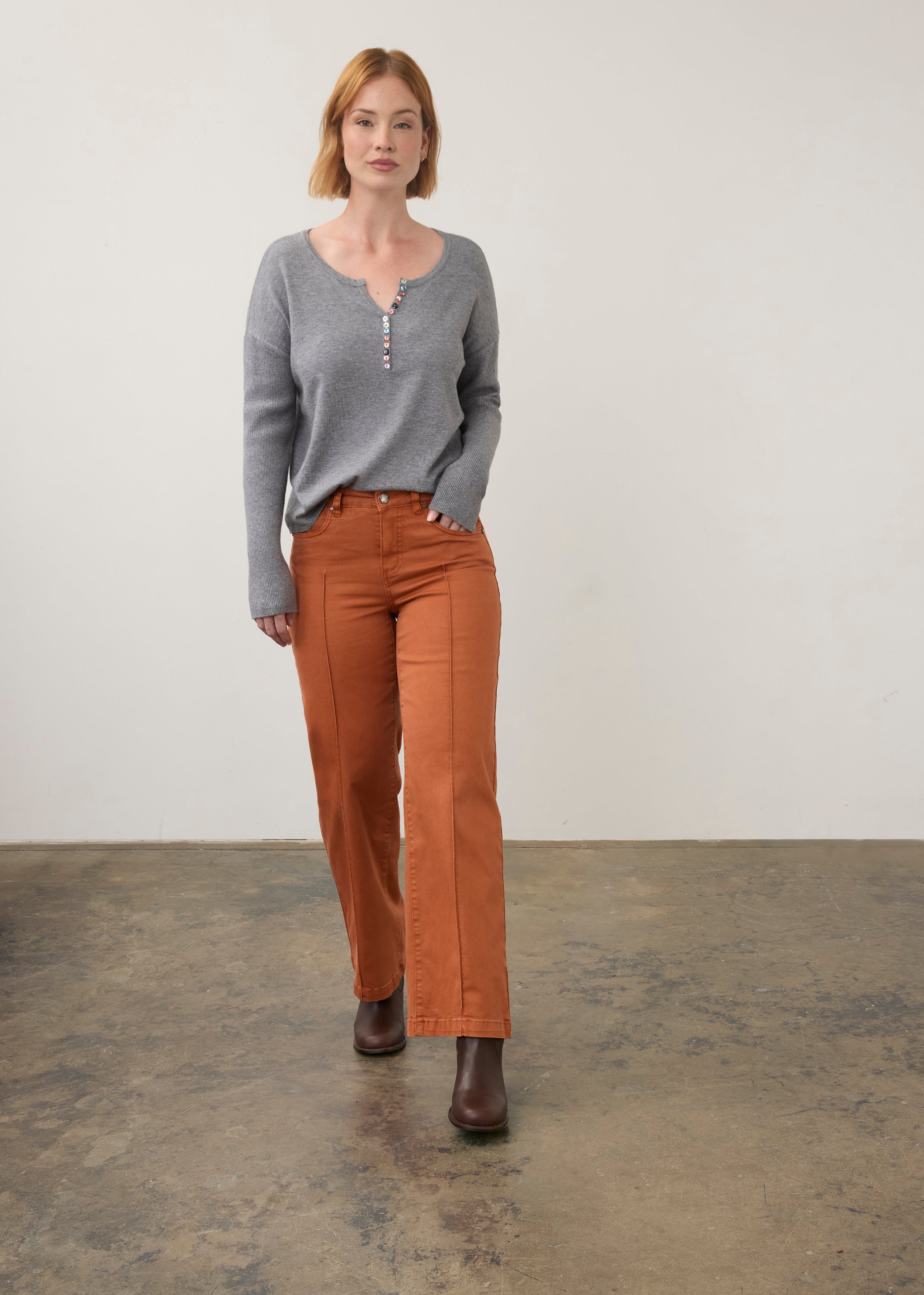 Full view of grey sweater paired with orange pants by French Dressing Jeans (FDJ)