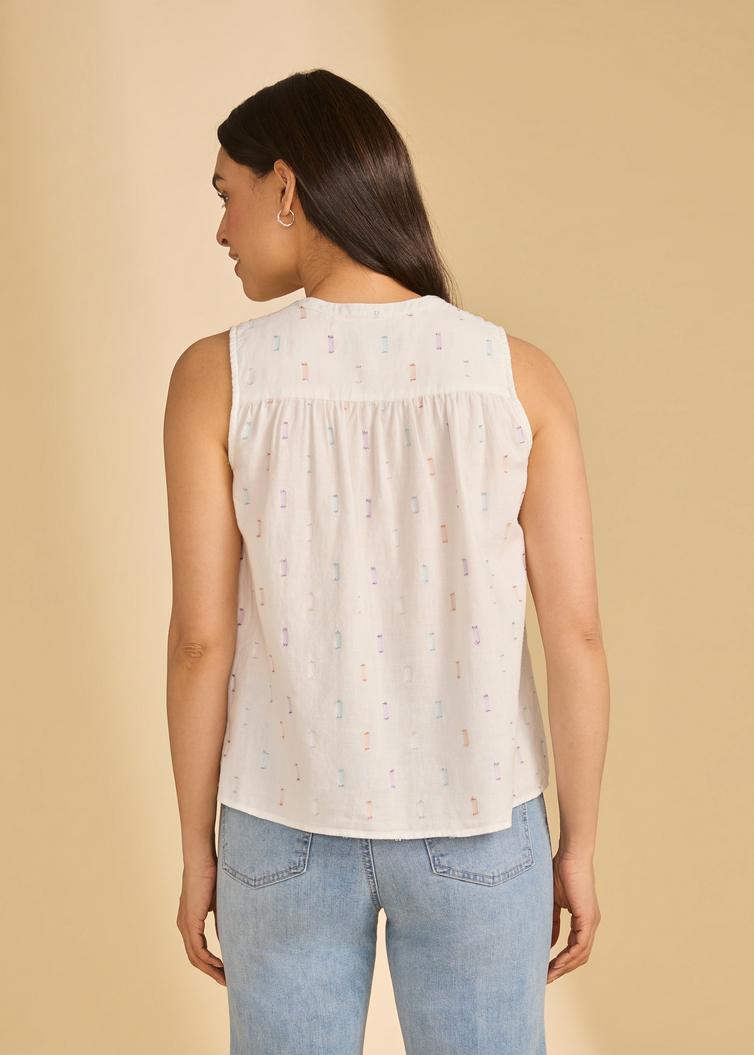 Back view of sleeveless white sparkle blouse, highlighting relaxed fit and subtle pattern, by French Dressing Jeans (FDJ)