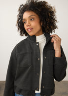 Close-up of charcoal knit bomber jacket showing button detail and patch pockets by French Dressing Jeans (FDJ)