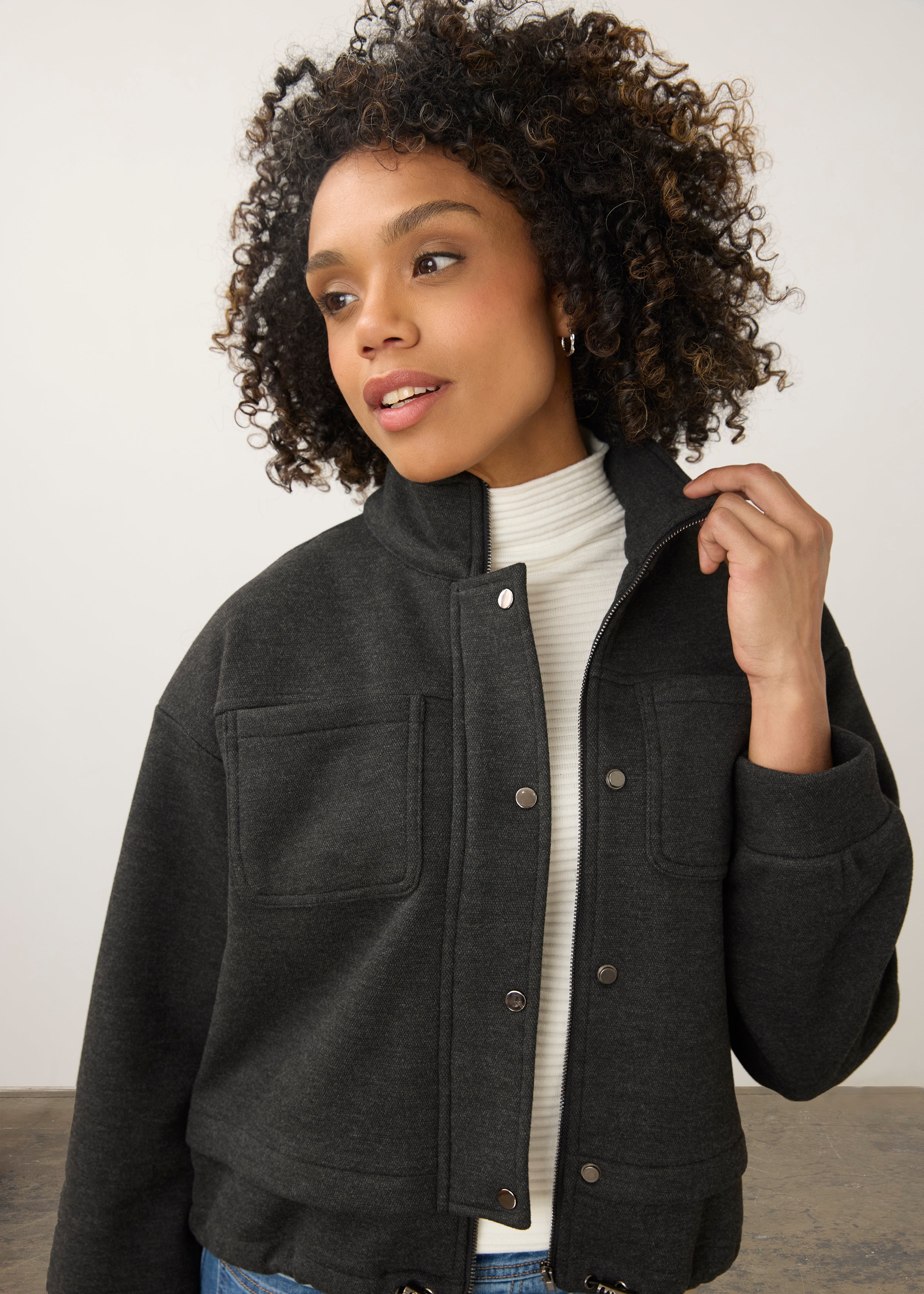 Close-up of charcoal knit bomber jacket showing button detail and patch pockets by French Dressing Jeans (FDJ)
