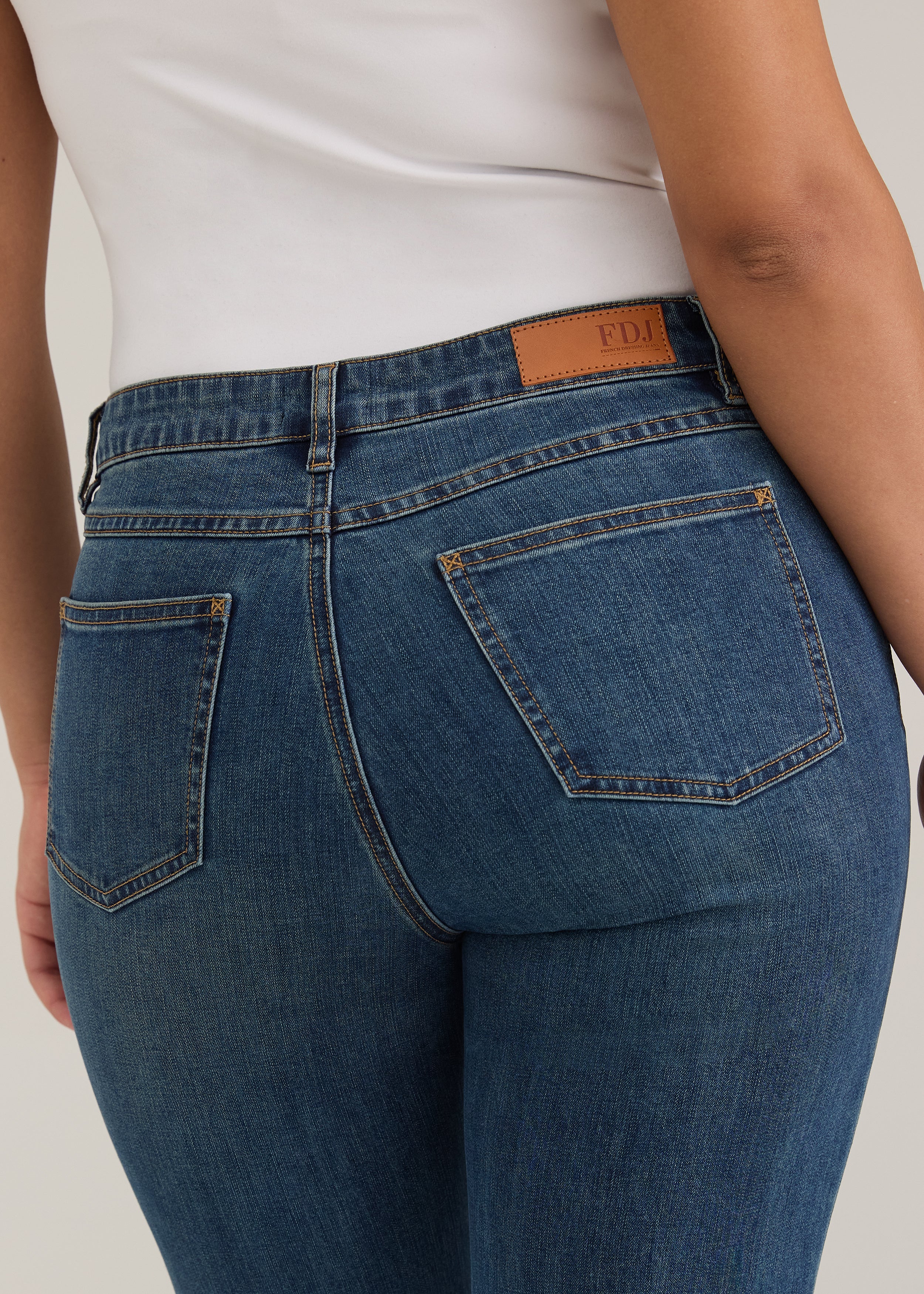 Detail shot of back pockets and waistline on dark wash Olivia straight leg denim by French Dressing Jeans (FDJ)
