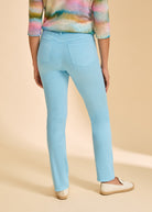 Close-up back view of light blue straight-leg jeans, showcasing classic pocket design by French Dressing Jeans (FDJ)