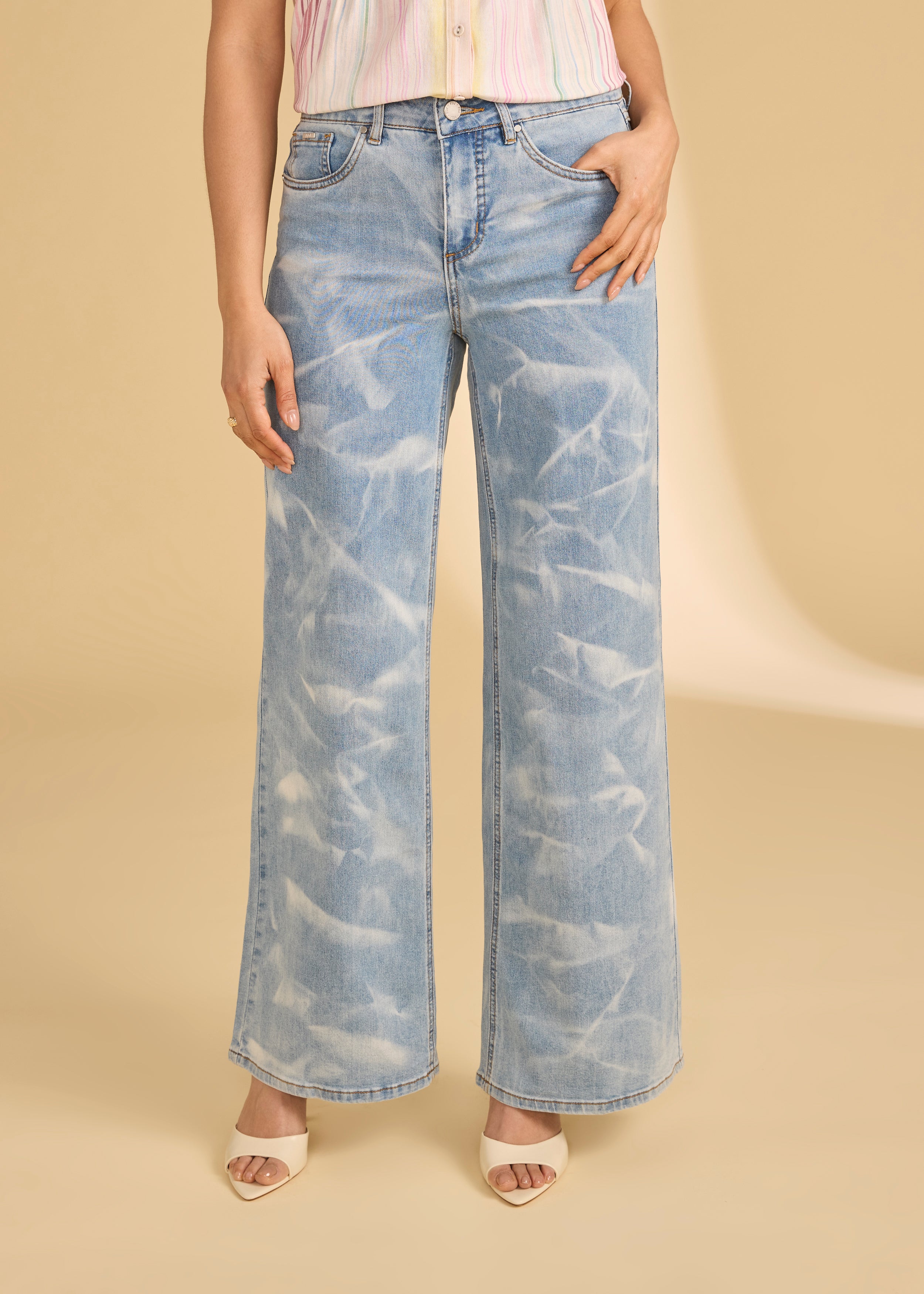 Close-up of light denim jeans with subtle pattern detail and front pocket by French Dressing Jeans (FDJ)