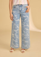 Close-up of light denim jeans with subtle pattern detail and front pocket by French Dressing Jeans (FDJ)