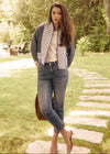 Outdoor shot of quilted jacket with intricate patterns, styled with jeans by French Dressing Jeans (FDJ)