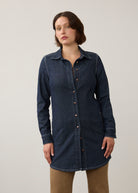 Front view of dark wash long denim tunic with button closure and side patch pockets by French Dressing Jeans (FDJ)