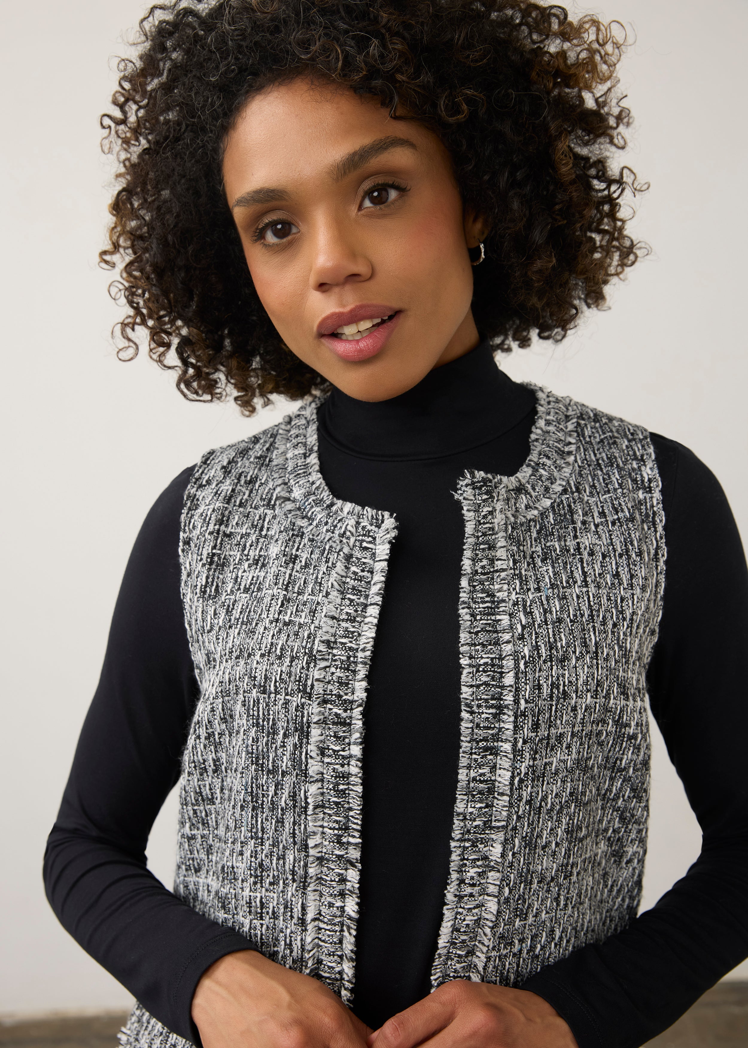 Close-up of black and white textured vest showing fringe detail and round neckline by French Dressing Jeans (FDJ)