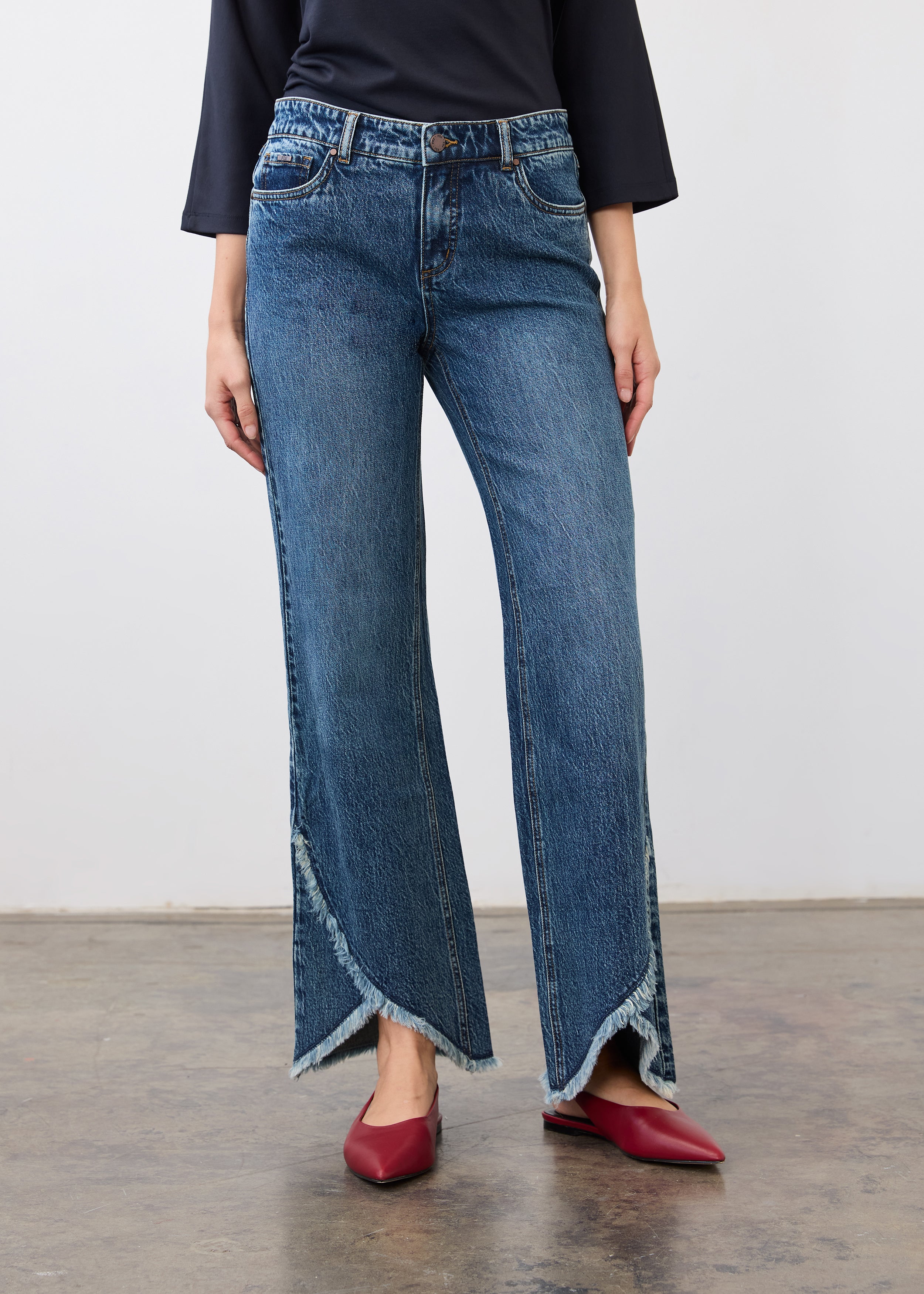 Front view of medium blue bootleg jeans with tulip hem and mid-rise fit by French Dressing Jeans (FDJ)