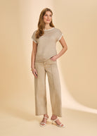 Full view of tan and white striped sweater with wide-leg beige pants by French Dressing Jeans (FDJ)