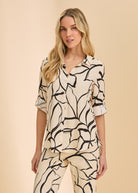 Front view of bold black and white patterned shirt with button front by French Dressing Jeans (FDJ)