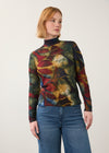 Front view of abstract print top in deep hues, paired with denim jeans by French Dressing Jeans (FDJ)