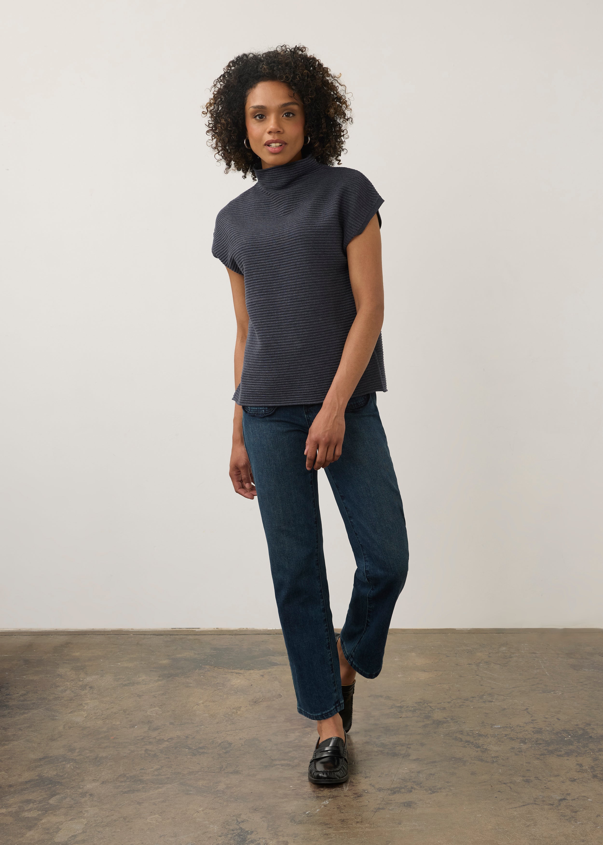 Model in navy ribbed top paired with jeans, full outfit view by French Dressing Jeans (FDJ)