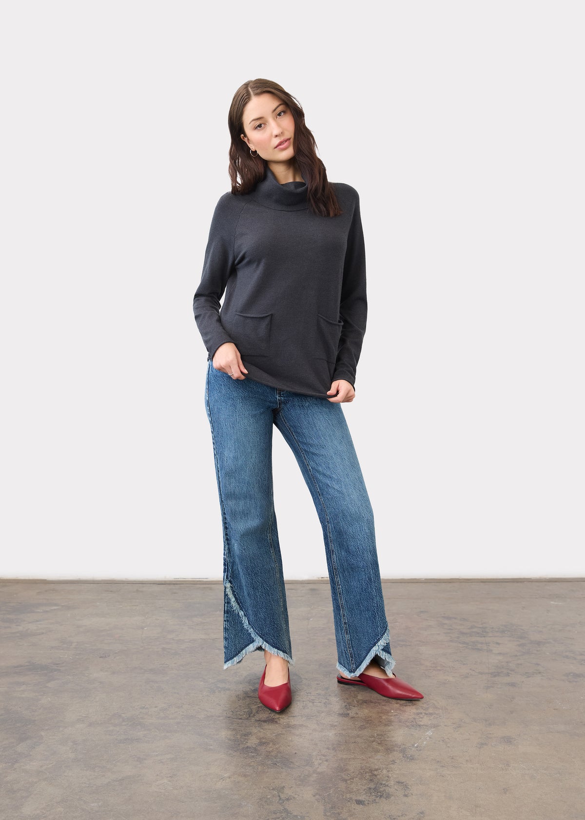 Full-length view of charcoal sweater styled with blue jeans by French Dressing Jeans (FDJ)